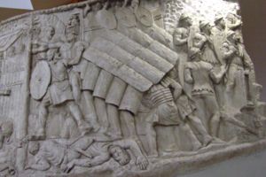 The testudo performed during a siege, as shown on Trajan's Column